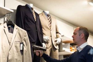 C&A performing cycle count on with an handheld RFID reader equipped with Checkpoint Merchandise Visibility software